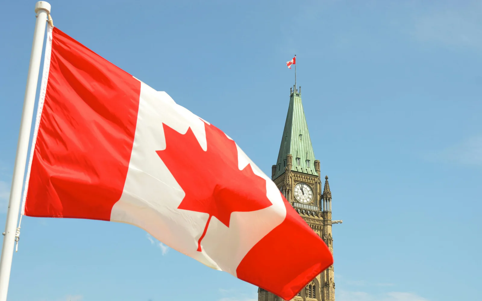 Canadian flag outside a modern building